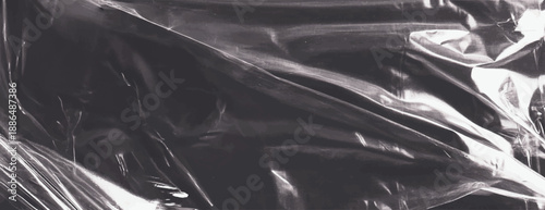 Brown background vector.A shiny, metallic silver background with a crumpled texture. The silver background creates a reflective, dynamic effect. Plastic foil wrap texture background.