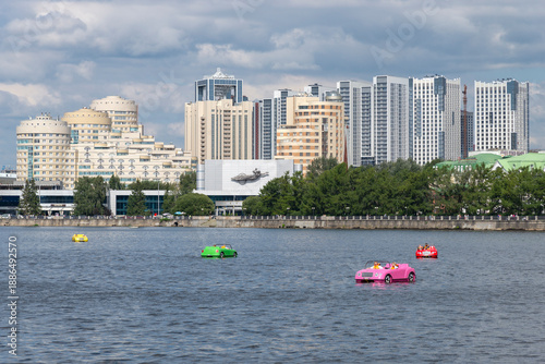 Catamarans in the form of cars on the Iset River. Yekaterinburg