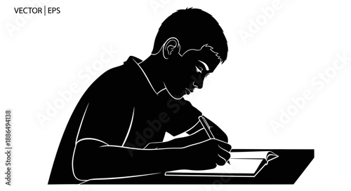 Young boy focused on writing at a desk.