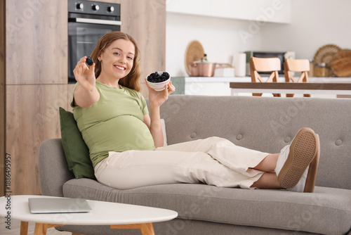 Young pregnant woman with d...