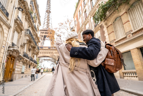 Loving couple embracing in paris near eiffel tower