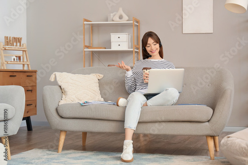 Young woman working from ho...