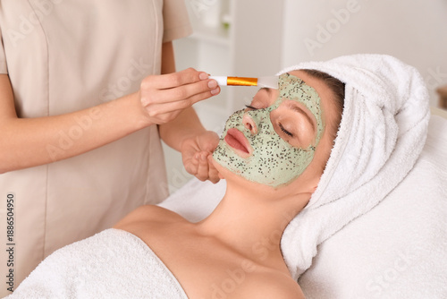 Cosmetologist applying chia...