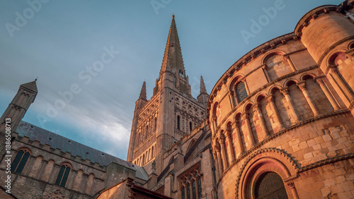 Canvas Print Norwich Cathedral in Norfolk, England in low winter sun with a cloudy background