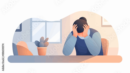 Person holds head in hands, stressed at a desk in a room with a plant