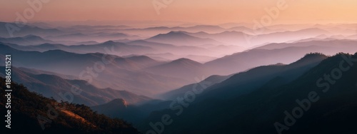 Panel kuchenny z motywem Serene Wide Shot of Layered Mountainous Horizon with Mist During Sunset