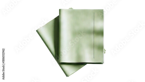Two green textured notebooks on a white background with shadow overlay