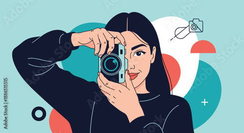 Creative photographer woman holding a professional camera to her eye and smiling while taking pictures against an abstract background.