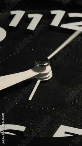Tme lapse video of a clock time passing over a day to night on black background.