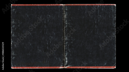 Fotografía Worn black notebook cover spread with red border on black background