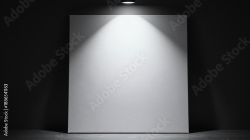 Blank white canvas stands illuminated by a spotlight in a dark gallery space, ready for artwork display