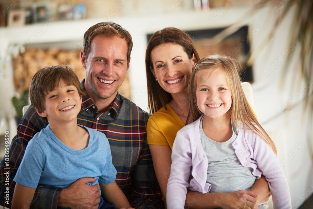 Obraz premium Smile, hug and portrait of family in home for bonding, support and connection. Love, happiness and relax with parents and children in living room of apartment for care, commitment and trust together