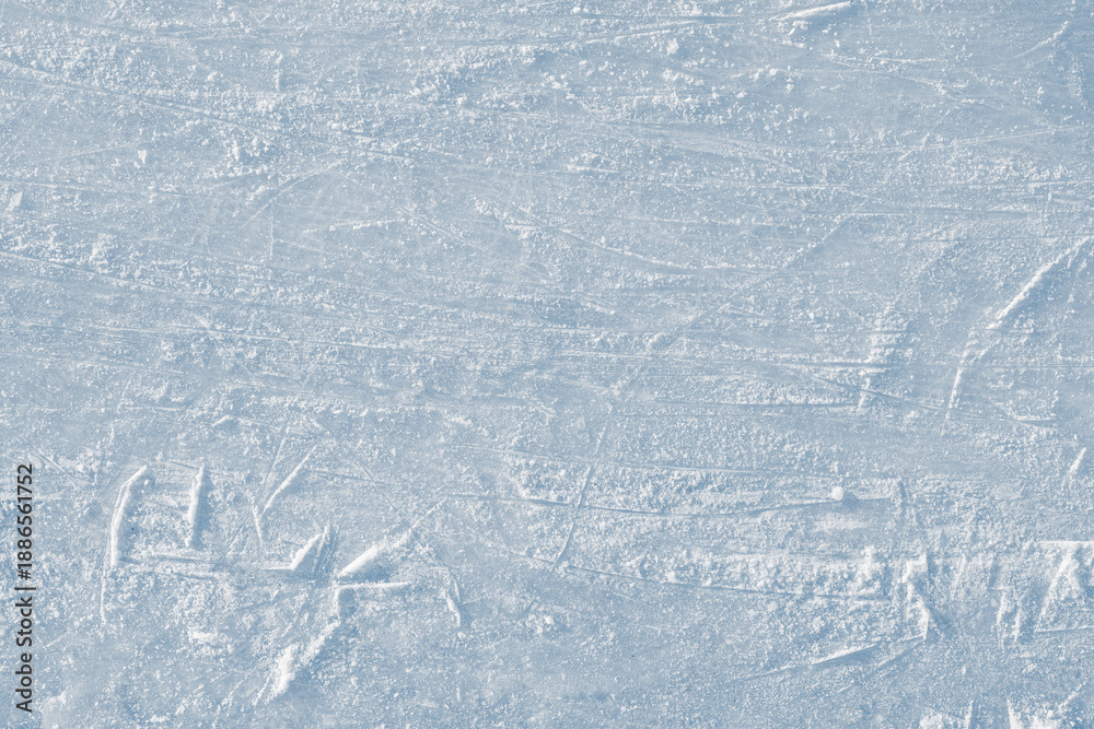 Fototapeta premium Scratched ice rink natural texture background.