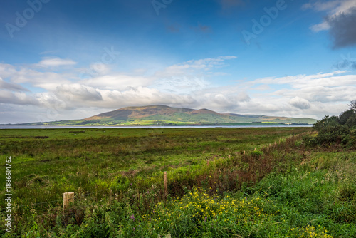 Canvas Print Criffel mountain rising above Solway Firth marshlands near Dumfries, Scotland