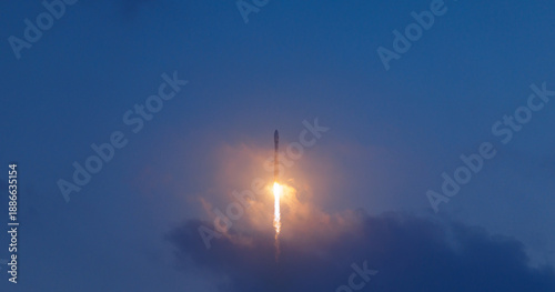 Tableau sur toile Rocket launch illuminating evening sky with glowing trail, aerospace program con