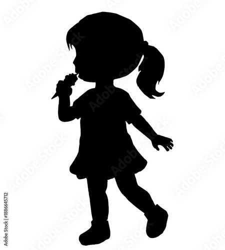 silhouette of a little girl eating ice cream in her hand