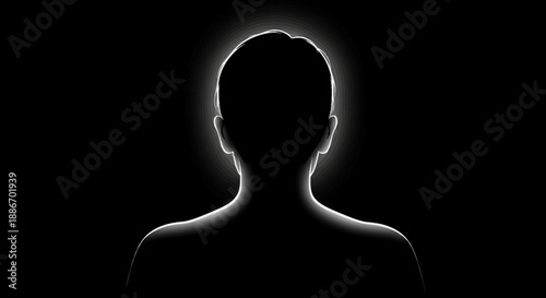 Silhouette of a Person with a Halo Effect Glowing Against a Dark Background
