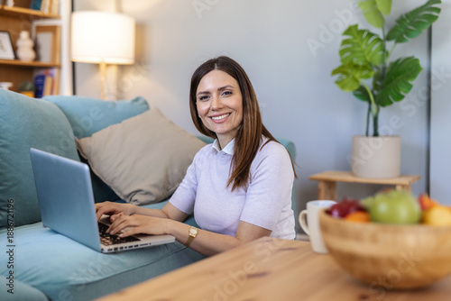 Foto Happy, woman or student with laptop on floor for distance learning, remote work or online course at home
