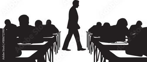 Silhouette of a man walking between rows of seated students in a classroom