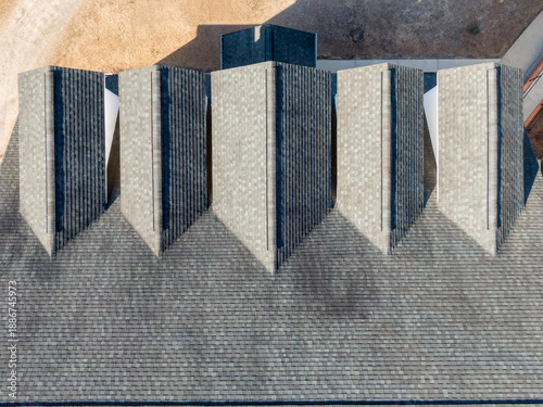 Φωτογραφία Top-Down Aerial Drone View of Five Architectural Roof Dormers Featuring Weathere