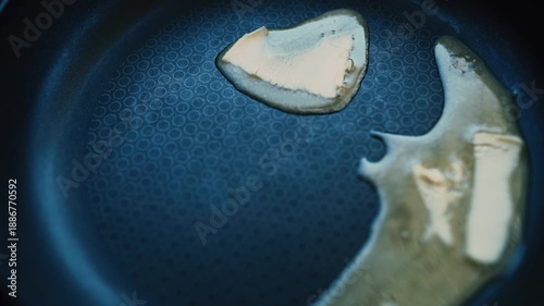 Melted butter in a frying pan, shot from above, ready to sizzle and cook delicious food.  Cederberg, South Africa