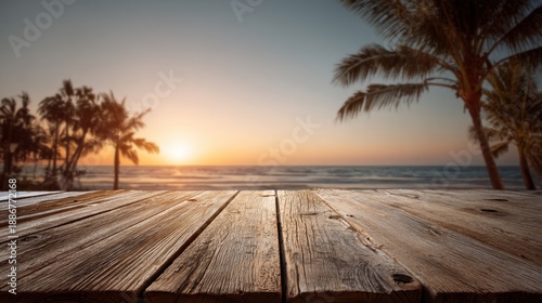 Tranquil beach sunset with palm trees and wooden deck.