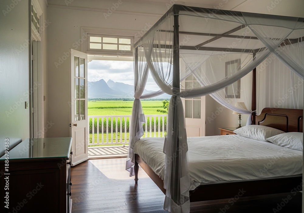 Fototapeta premium Colonial style bedroom interior with canopy bed and open door view to green fields and mountains