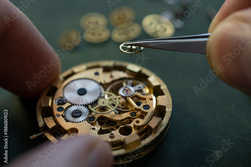 Closeup image of a watchmaker's workshop with dissembled watches and tools