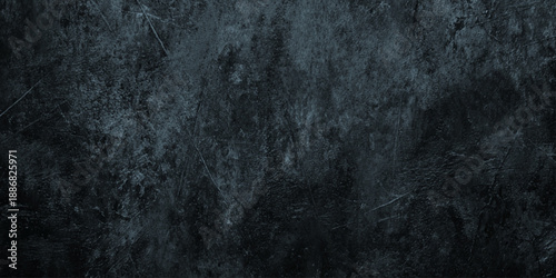 Dramatic dark wall concrete texture with heavy scratches weathered grit deep scratches, scuffs, and a weathered concrete appearance.