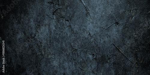 A high contrast moody abstract wall background featuring a dark grey stone surface vignetted edges and atmospheric lighting make it ideal for cinematic posters.