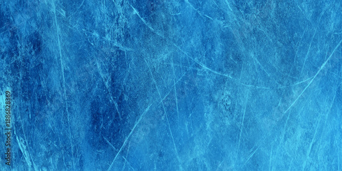 Abstract background featuring a deep sapphire blue color palette heavily textured with organic scratches.