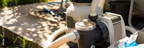 Pump of filtration, ozonation system is used to maintain clean, sanitary environment an outdoor swimming pool