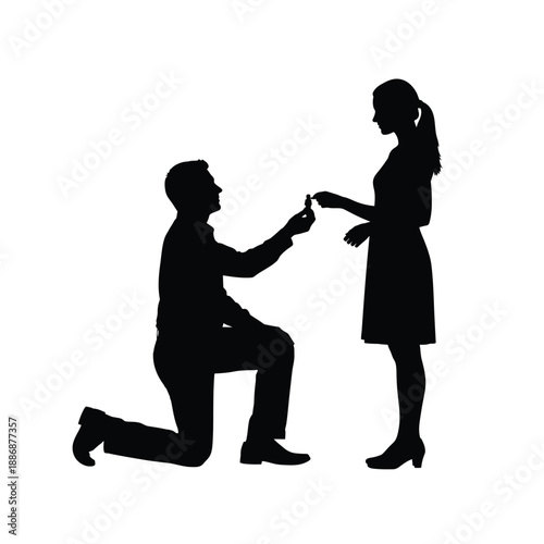 Man proposing to woman with ring on one knee silhouette