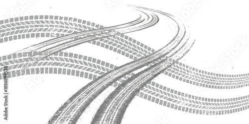 Dynamic gray tire track patterns creating an abstract background with curving lines