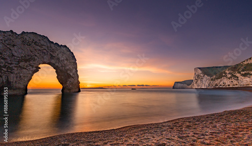 Bild auf Leinwand Durdle Door sea arch at sunset Dorset England
