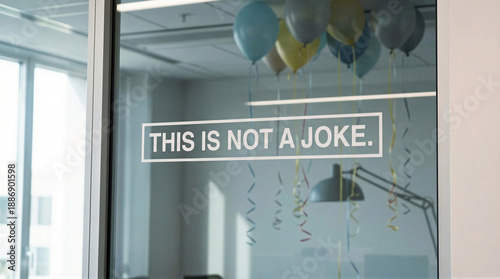 Wallpaper Mural Office window displaying this is not a joke message with blue silver balloons and streamers. April fools day prank signage in modern workplace. Humorous announcement for surprise alerts and fun Torontodigital.ca