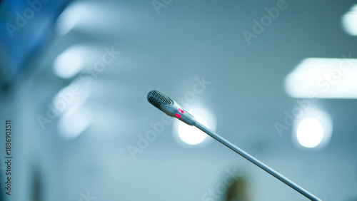 Photos Electronic table microphone with illuminated indicator waiting for a speaker