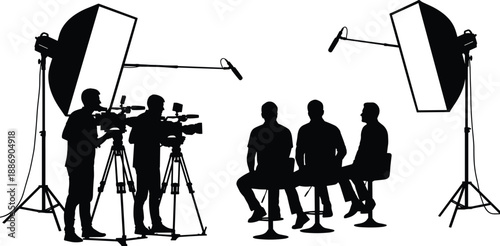 Film crew silhouette shooting television interview with cameras, professional lighting equipment, microphones and presenters in studio,