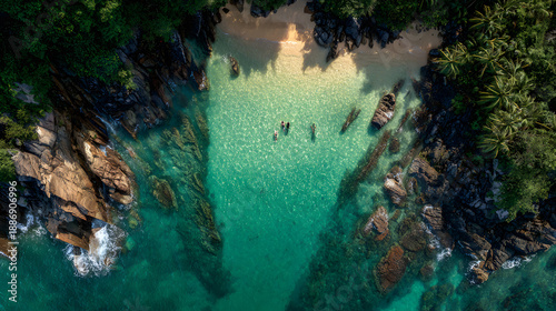Aerial view of beach with people in water