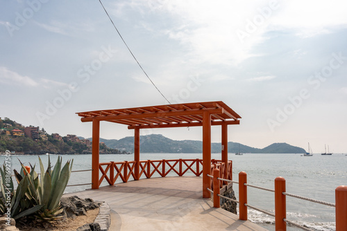 Bild auf Leinwand Panoramic view of the Zihuatanejo Boardwalk facing the sea in Costa Grande, Guerrero