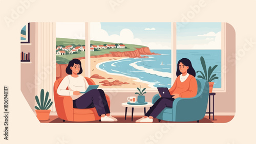 Two women relax indoors with laptops, overlooking a coastal village scene