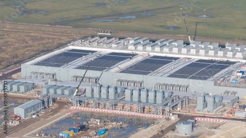 Groningen, Netherlands - 20 January 2026: Aerial view of the expansive Google data center under construction, a stark contrast to the soft, muted tones of the surrounding Dutch landscape.
