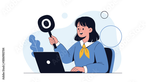 Smiling schoolgirl in a blue uniform sitting at a laptop and holding up a circular sign with a large O mark for correct.