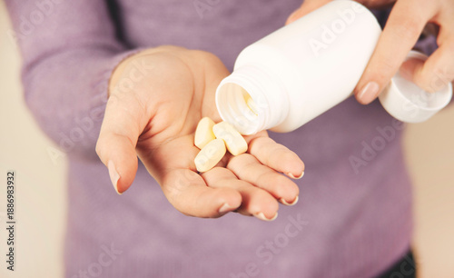 hands holding a pill