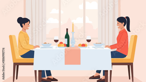 Two women seated at a table for dinner with wine, food, and candles