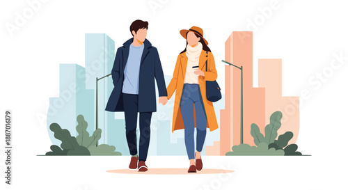 Fashionable young couple wearing winter coats and holding hands while taking a romantic walk through a modern city on a date.