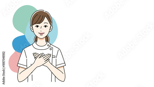 Kind female nurse or medical worker in a white uniform standing with her hands over her heart to show care and compassion.