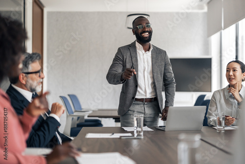 фотографія Black businessman leading presentation during diverse team meeting