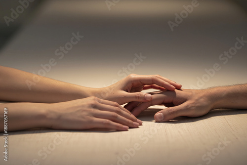 Wallpaper Mural Gentle Human Touch Between Two People Across Wooden Table, Minimal Scene Expressing Trust, Emotional Connection and Quiet Support Torontodigital.ca