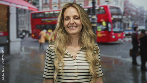 Wallpaper Mural Confident woman hair flowing while smiling on a busy street with young blonde outdoors vibe in an urban city landscape as a red bus passes by. Torontodigital.ca